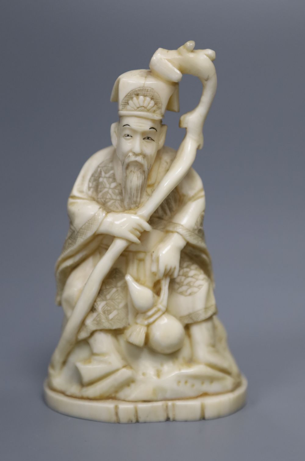 A Japanese walrus ivory figure of an immortal, height 11cm